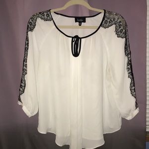 White blouse with black lace detail